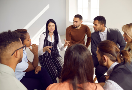 A group sitting in a circle having a discussion 